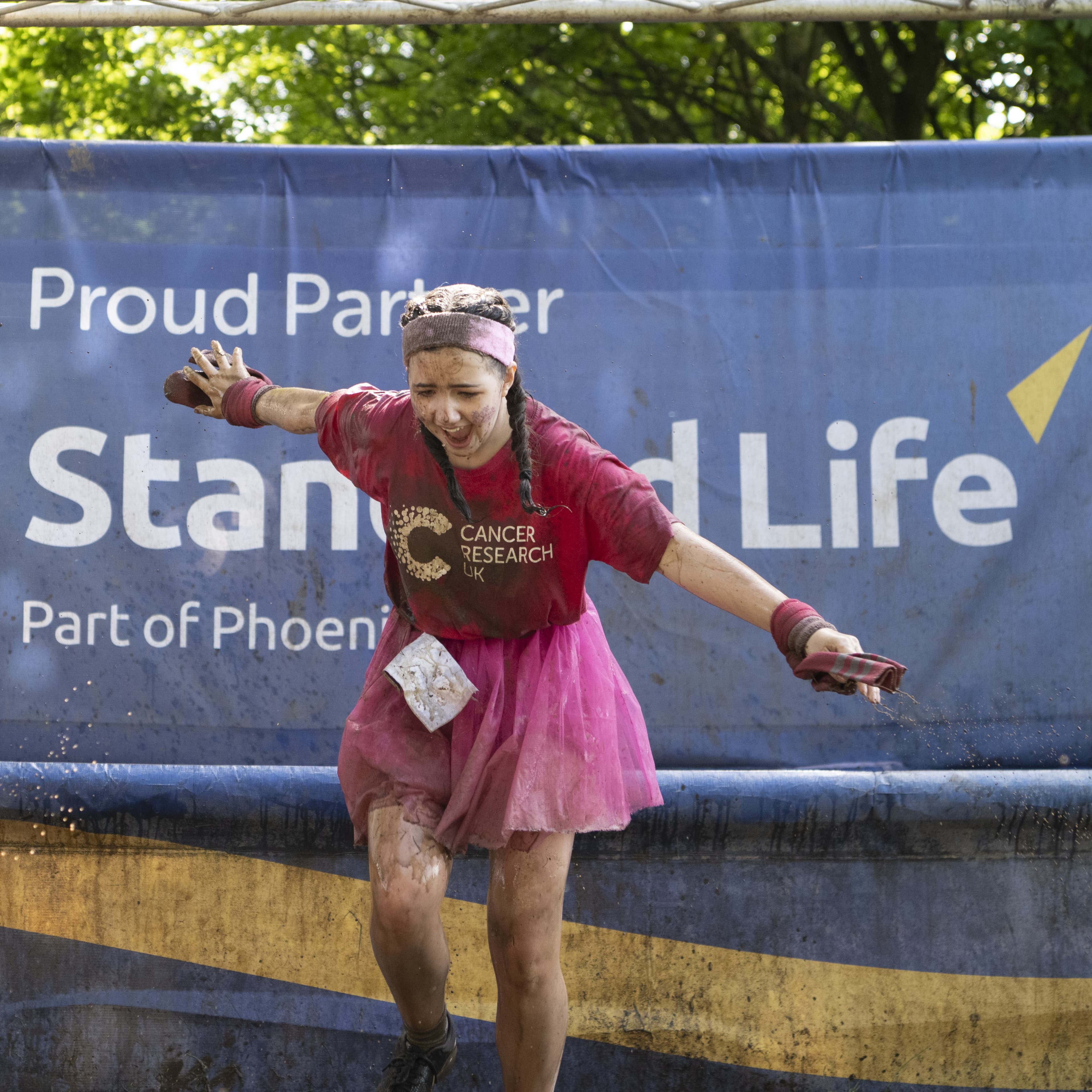 Pretty muddy the journey event supporter running to the finish line.